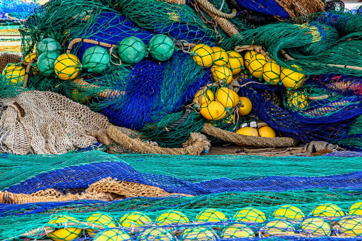 Vibrant fishing nets and floats at Cartagena Harbor, showcasing marine craftwork.